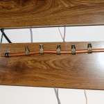 Copper pipe attached to desk